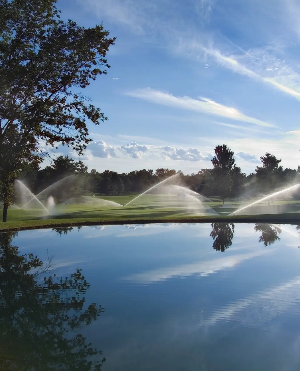 photo of sprinklers on a golf course